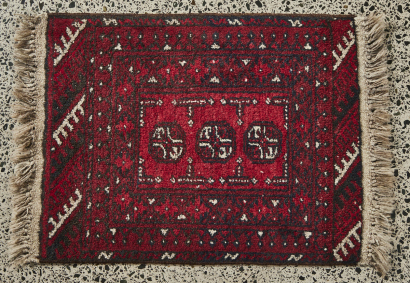 A Small Hand Knotted Afghan Rug