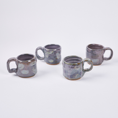 A Set Of Four Handcrafted Wobbly Espresso Cups