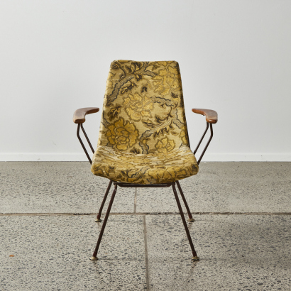 A Vintage Wire Chair With Wooden Arms