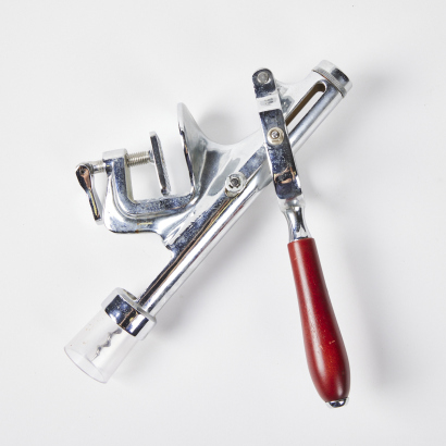 A Bench-Mounted Wine Bottle Opener