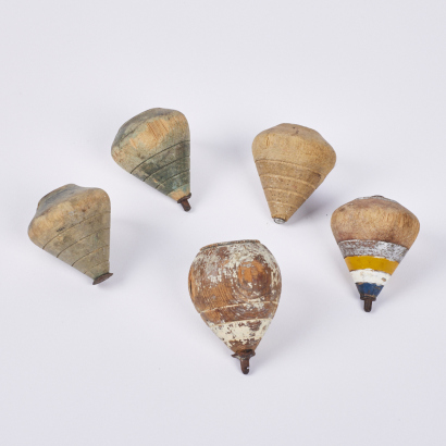 A Collection Of Five Vintage Spinning Tops