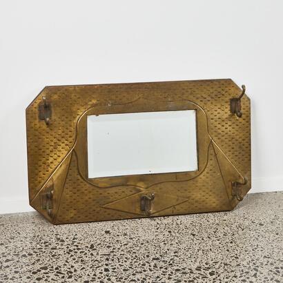 A Mirror with Coat Hooks