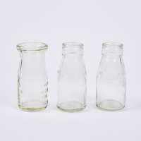 A Collection Of Three Small Vintage Milk Bottles