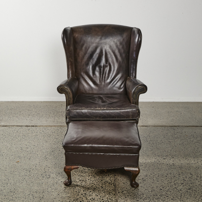 A Vintage Wingback Leather Library Chair with Footstool