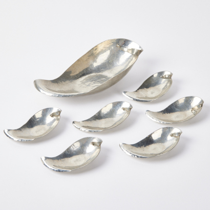 A Decorative Beaten Metal Oyster Dishes