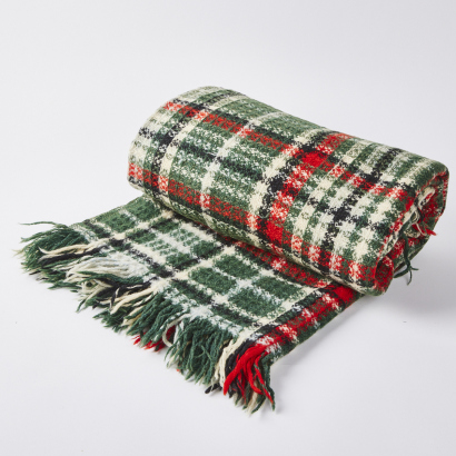 An Onehunga Mills Plaid Waffle Wool Rug With An Old Tiki Label
