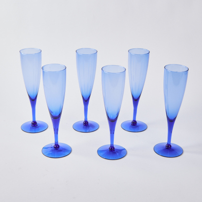 A Set Of Six Blue Glass Champagne Flutes