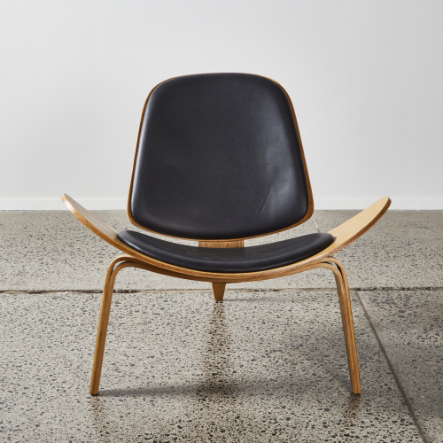 A Hans Wegner Style Shell Chair In Oak & Black Upholstery