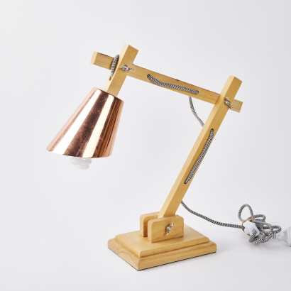 An Adjustable Wooden Lamp With Copper Shade