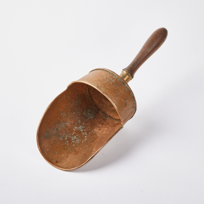 A Vintage Handheld Copper Coal Scoop