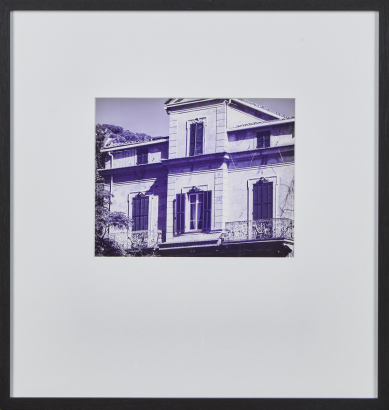 A Framed Black And White Photographic Print Of A Villa