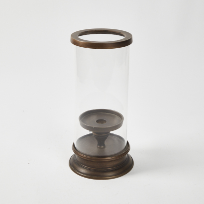 A Candle Holder With Glass Cover