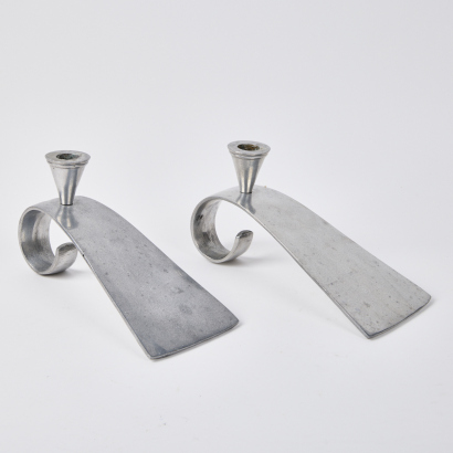 A Pair Of Aluminium Candlestick Holders