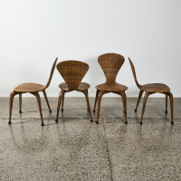 A Set Of Four Norman Cherner Style Rattan Dining Chairs