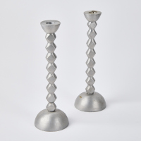 A Pair Of Aluminum Candle Sticks