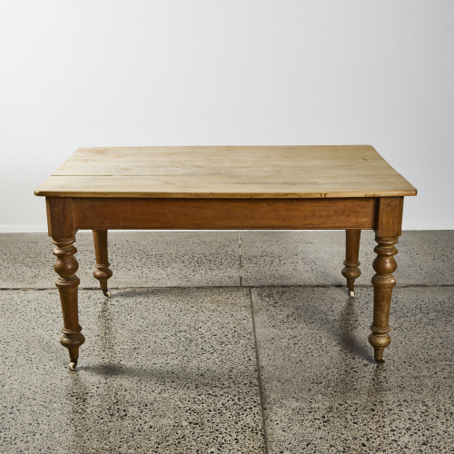 A Kauri Kitchen Table With Porcelain Wheels