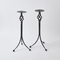 A Pair Of Wrought Iron Candlestick Holders