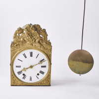 An Antique French Wall Clock With Figural Panel Relief