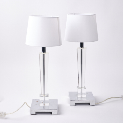 A Pair Of Bedside Lamps With A Lucite Base