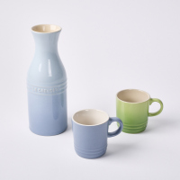 A Le Creuset Ceramic Jug & Two Cups