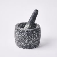 A Granite Mortar And Pestle
