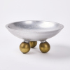 An Aluminium Bowl With Brass Ball Feet