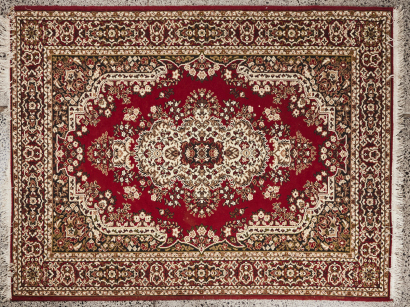 A Large Hand Knotted Floor Rug In Red