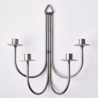 A Steel Wall Mounted Candle Holder