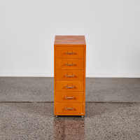 A Retro Metal Storage Cabinet In Orange