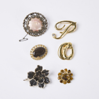 A Collection of Six Vintage Brooches