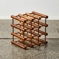 A Vintage Wooden Nine Bottle Wine Rack