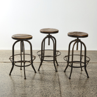 A Trio Of Industrial Barstools With Adjustable Swivel Seat