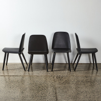 A Suite of Four Black Designer Chairs with Formed Ply Seat & Metal Base