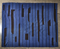 A Blue and Black Kilim Rug