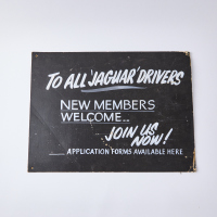 A Double Sided Sanyo and Jaguar Drivers Sign