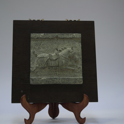A Chinese carved horse on slab