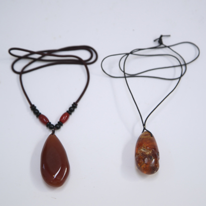 Two pieces of Chinese agate and amber pendants