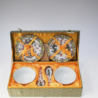 A set of paired Chinese 'dragon' bowls and plates for wedding use