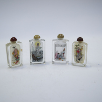 Four Chinese 20th-century inside- painted ' figural' glass snuff bottles