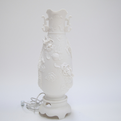 A Chinese Dehua white porcelain 'dragon' vase