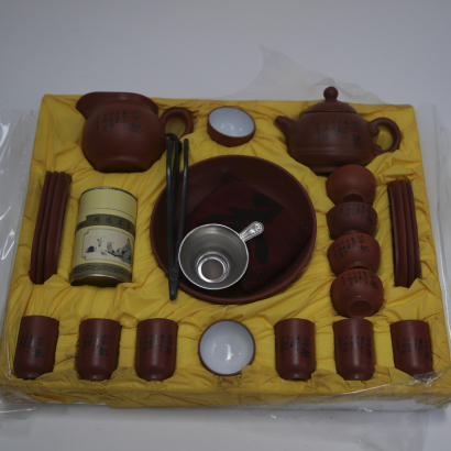 A set of Chinese purple clay tea set in a box