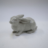 A Japanese Kyo Ware porcelain rabbit ornament