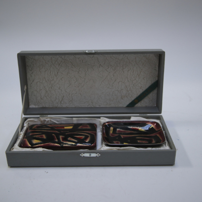 A set of Japanese cloisonn enamelled metal boxes and plates