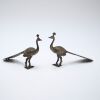 A pair of modern bronze peacocks