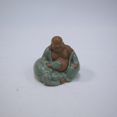 A Japanese 20th-century Kutani seated Buddha statue