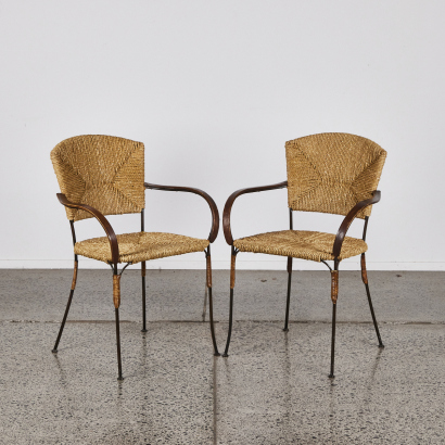 A Pair Of Mid Century Woven Chairs With Metal Legs