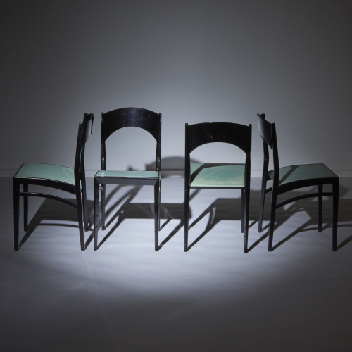 A Set of Four Mid-Century Italian Black Lacquer Dining Chairs