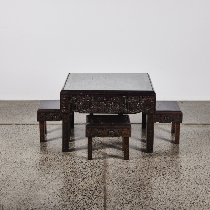 A Chinese Carved Folding Table With Four Folding Stools