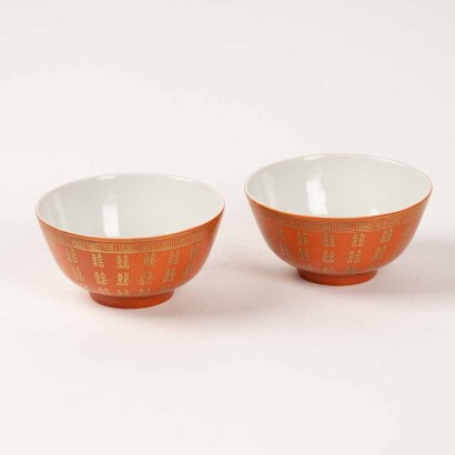 A Pair of Chinese ccral red ground gilt 'Xi' bowls (Daqing guangxu year mark)