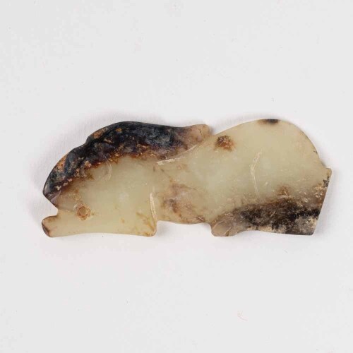 &nbsp;A Chinese early Shang and Zhou dynasty flake carved jade rabbit
